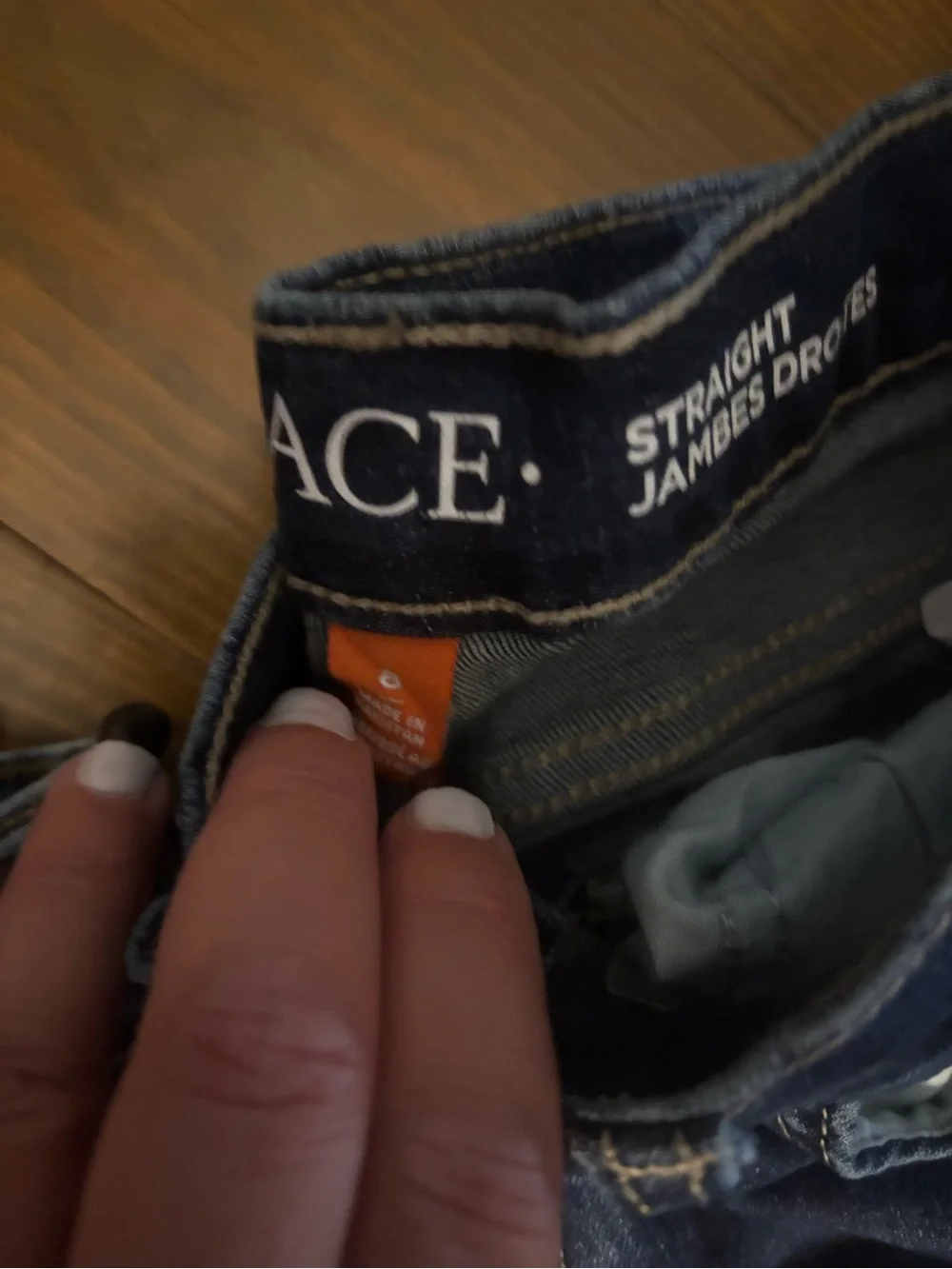 Three pairs of The Childrens place jeans and 1 pair of TCP navy cargo pants